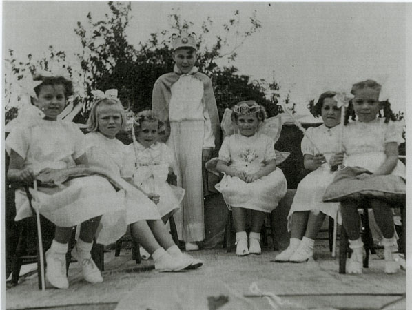 Copy of an undated photograph of seven children in fancy dress at a carnival in Llangwm Pembrokeshire
